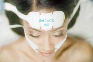 Woman getting botox alternative treatment with emface