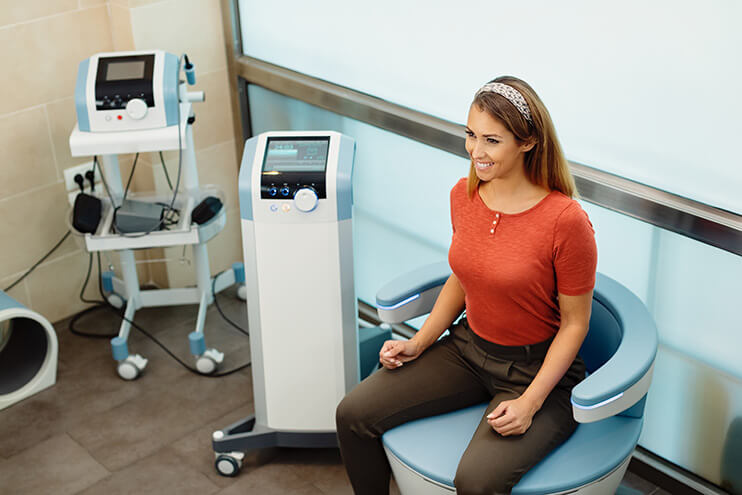 Emsella device in use to strengthen pelvic floor