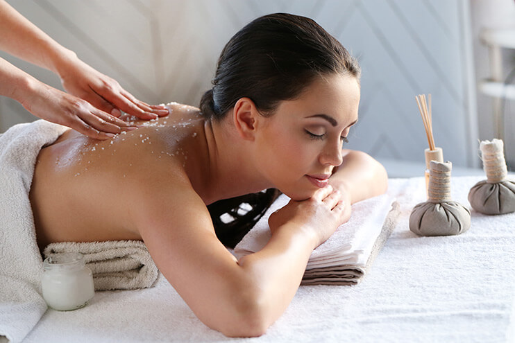 Woman getting a massage at a day spa